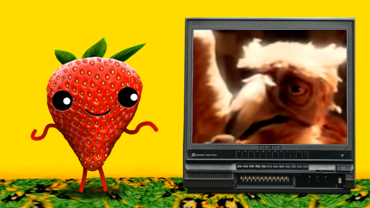 A Strawberry Watches Television